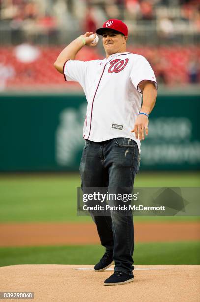 Washington Redskins outside linebacker Ryan Kerrigan throws a ceremonial first pitch before a game between the New York Mets and Washington Nationals...