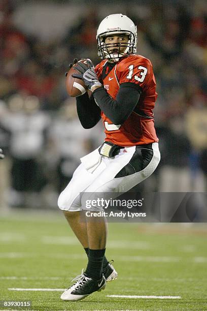 Quarterback Nate Davis of the Ball State Cardinals looks to pass the ball during the MAC game against the Western Michigan Broncos at Scheumann...