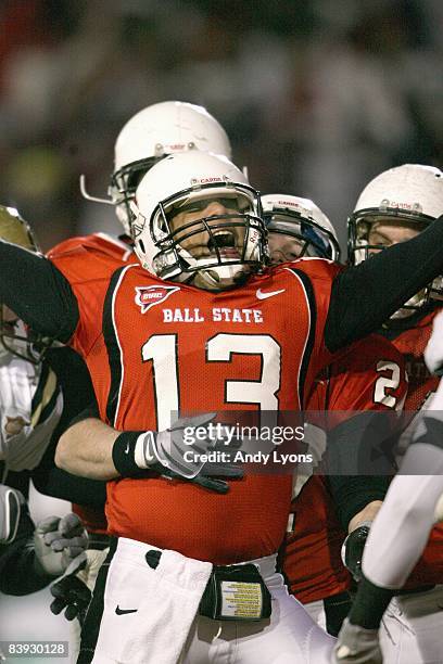 Quarterback Nate Davis of the Ball State Cardinals celebrates on the field during the MAC game against the Western Michigan Broncos at Scheumann...
