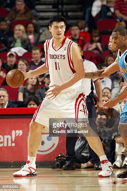 Yao Ming of the Houston Rockets surveys the court against the New Orleans Hornets during the game on November 15, 2008 at the Toyota Center in...