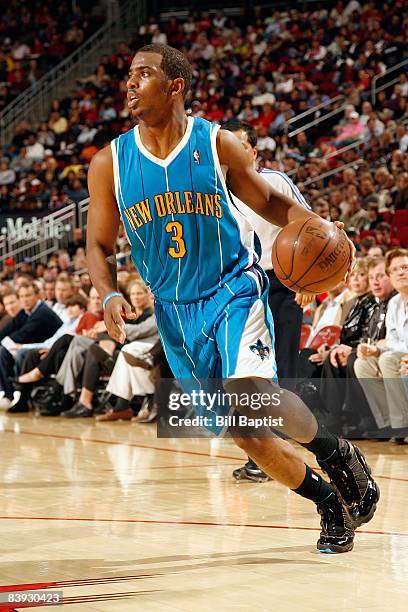 Chris Paul of the New Orleans Hornets drives against the Houston Rockets during the game on November 15, 2008 at the Toyota Center in Houston, Texas....