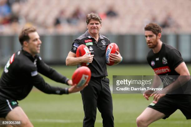Collingwood assistant coach Robert Harvey looks on before the round 23 AFL match between the Collingwood Magpies and the Melbourne Demons at...