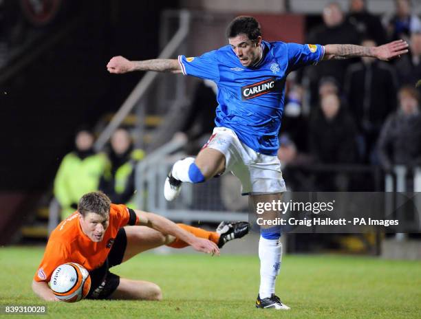 Rangers Nacho Novo is challenged by Dundee Uniteds Darren Dods during the Clydesdale Bank Scottish Premier League match at Tannadice Park, Dundee...