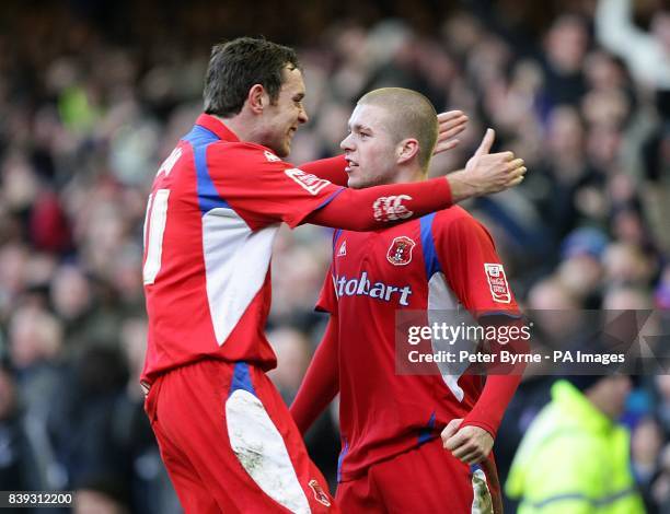 Carlisle United's Adam Clayton celebrates teammate Kevan Hurst's goal with teammate Richard Keogh