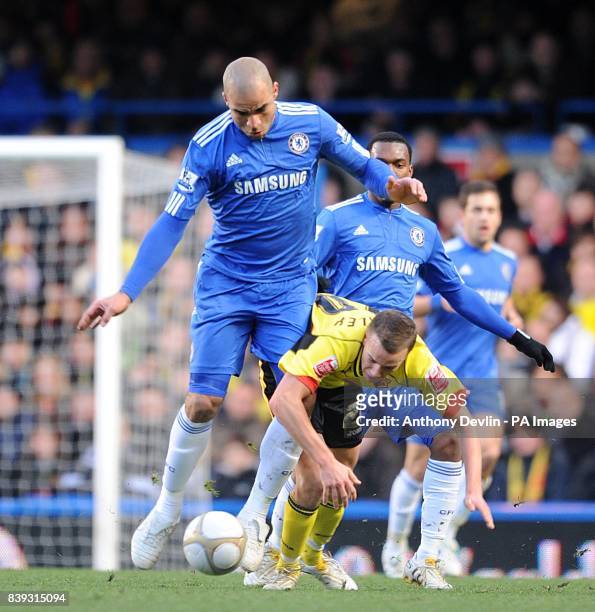 Watford's Tom Cleverley and Chelsea's Alex battle for the ball