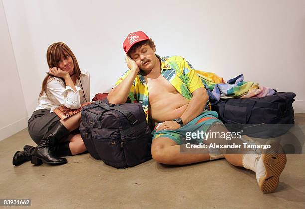Guest poses with "Traveller" by Duane Hanson at the Van De Weghe Fine Art Gallery at Art Basel Miami Beach Art Basel Miami Beach at Miami Beach...