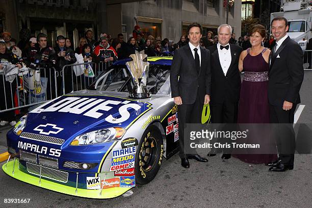 Jimmie Johnson, 2008 NASCAR Sprint Cup Champion, poses with Robert Niblock, CEO of Lowe's, his wife Melanie Niblock and Crew Chief Chad Knaus prior...