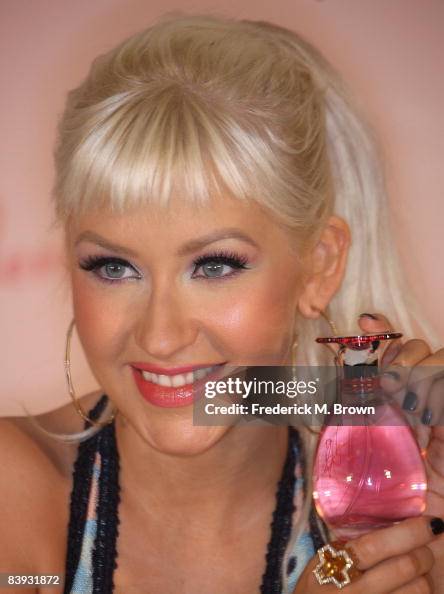 Recording artist Christina Aguilera poses for photographers during an ...