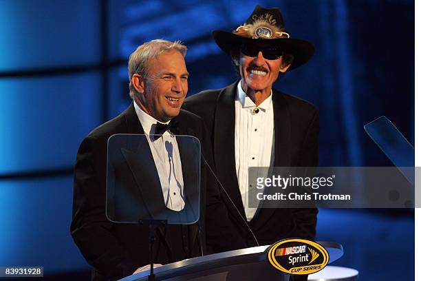 Actor Kevin Costner and past NASCAR Champion Richard Petty speak during the NASCAR Sprint Cup Series Awards Ceremony at the Waldorf Astoria on...