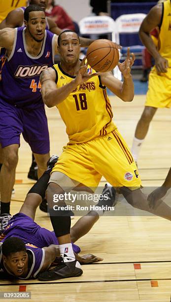 Coleman Collins of the Fort Wayne Mad Ants battles Courtney Simms and Othyus Jeffers of the Iowa Energy at Allen County Memorial Coliseum on December...