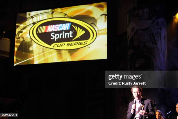 Of Sprint Dan Hesse toast 2008 NASCAR Sprint Cup Series Champion Jimmie Johnson, driver of the Lowe's/Kobalt Tools Chevrolet, during NASCAR Sprint...