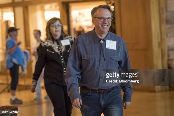 John Williams, president of the Federal Reserve Bank of San Francisco, center, arrives for a dinner during the Jackson Hole economic symposium,...