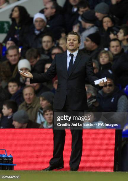 Peterborough United manager Mark Cooper shrugs his shoulders on the touchline during the FA Cup Third Round match at White Hart Lane, London.