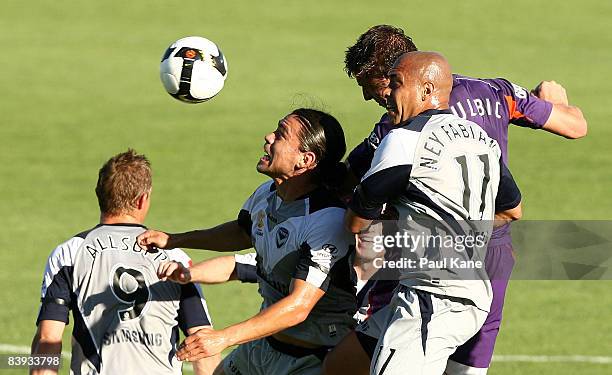 Dino Djulbic of the Glory, Rodrigo Vargas and Ney Fabiano of the Victory compete ffor the ball during the round 14 A-League match between the Perth...