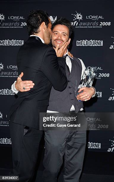 Actor Alex Dimitriades congratulates his co-star Damian Walshe-Howling on his AFI Award for Best Guest Or Supporting Actor in a Television Drama for...