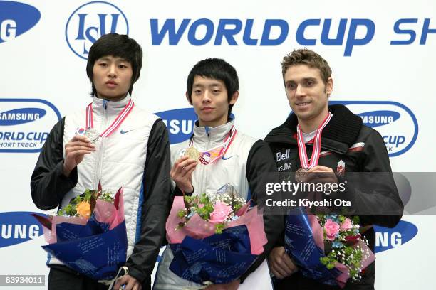 Silver medalist Sung Si-bak of South Korea, gold medalist Lee Jung-su of South Korea and bronze medalist Francois-Louis Tremblay of Canada pose for...