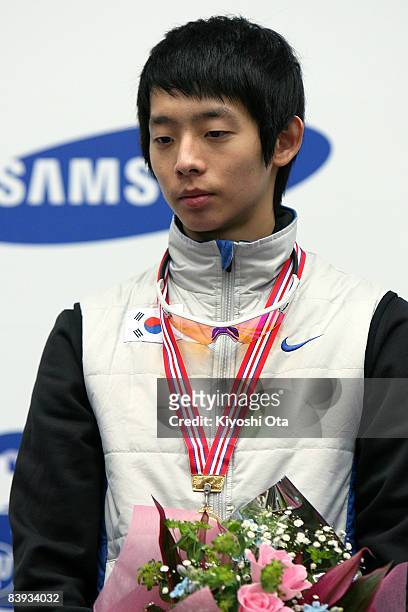 Gold medalist Lee Jung-su of South Korea celebrates on the podium at the award ceremony after the Men's 1500m final during the Samsung ISU World Cup...