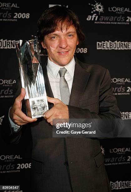 Actor Chris Lilley poses with the AFI Award for Best Television Comedy Series for "Summer Heights High" backstage in the Awards Room at the L'Oreal...