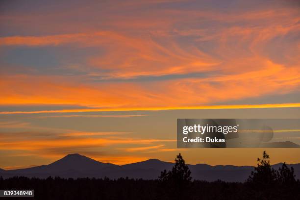 Oregon, Deschutes County, Bend, Mount Bachelor at sunset.