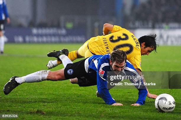 Thorben Marx of Bielefeld and Tamas Hajnal of Dortmund in action during the Bundesliga match between Arminia Bielefeld and Borussia Dortmund at the...