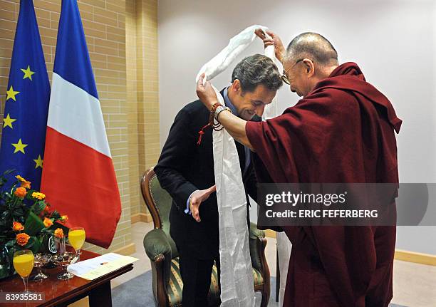 French President Nicolas Sarkozy is welcomed by the Dalai Lama in Gdansk, northern Poland, on December 6, 2008. As current holder of the European...