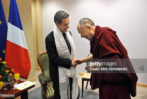 French President Nicolas Sarkozy is welcomed by the Dalai Lama in Gdansk, northern Poland, on December 6, 2008. As current holder of the European...