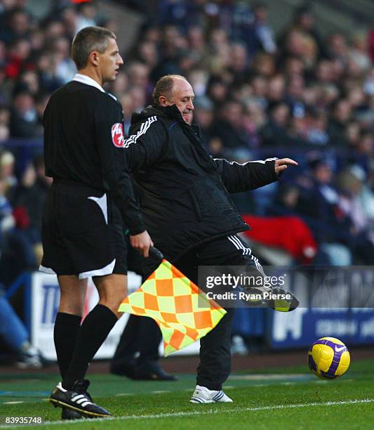 Luiz Felipe Scolari the Chelsea manager kicks the ball during the Barclays Premier League match between Bolton Wanderers and Chelsea at the Reebok...