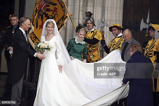 Archduchess Marie Christine of Austria and her father Archduke Christian of Austria stand on the steps of St. Rumbolds Cathedral before her wedding...