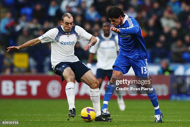 Michael Ballack of Chelsea holds off the challenge of Gavin McCann of Bolton Wanderers during the Barclays Premier League match between Bolton...