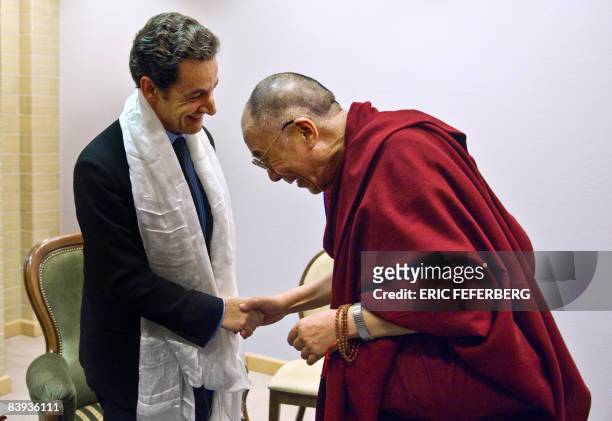 French President Nicolas Sarkozy is welcomed by the Dalai Lama in Gdansk, northern Poland, on December 6, 2008. As current holder of the European...