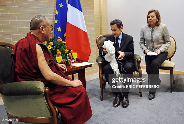French President Nicolas Sarkozy talks with the Dalai Lama during their meeting in Gdansk, northern Poland, on December 6, 2008. As current holder of...