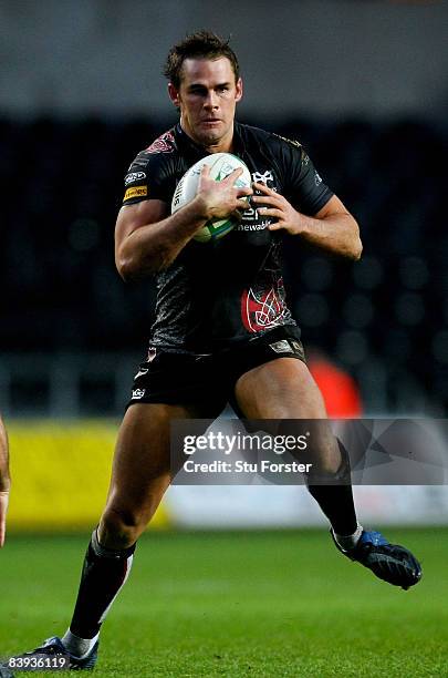 Ospreys full back Lee Byrne runs witht the ball during the Heineken Cup Match between Ospreys and Benetton Treviso at Liberty Stadium on December 6,...