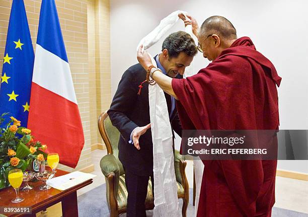 French President Nicolas Sarkozy is welcomed by the Dalai Lama on December 6, 2008 in Gdansk, northern Poland. As current holder of the European...