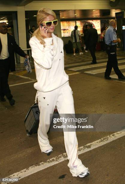 Paris Hilton arrives at the Miami International Airport for Art Basel Weekend on December 5, 2008 in Miami, Florida.