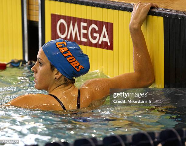 Teresa Crippen looks back at the scoreboard after swimming n the preliminaries of the 200 yard backstroke during the 2008 Short Course National...