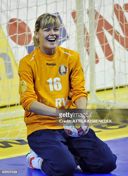 Belarusian goalkeeper Alena Abramovich reacts after beating Austria at the end of their 8th Women's Handball European Championships match on December...