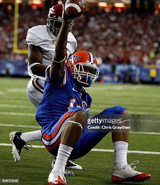 Carl Moore of the Florida Gators celebrates after making a touchdown catch over Kareem Jackson of the Alabama Crimson Tide during the SEC...
