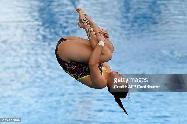 Singapore's Ashlee Tan Yi Xuan competes in the women's diving 3m springboard final of the 29th Southeast Asian Games at the National Aquatics Centre...