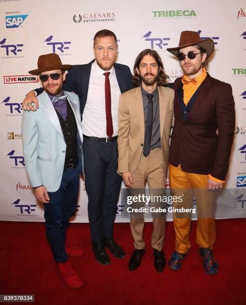 Bassist Ben McKee, singer/drummer Dan Reynolds, guitarist Wayne Sermon and drummer Daniel Platzman of Imagine Dragons attend the fourth annual Tyler...