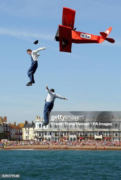 Competitors dressed as Laurel and Hardy take off from Worthing Pier in a model plane during the first day of the annual International Worthing...