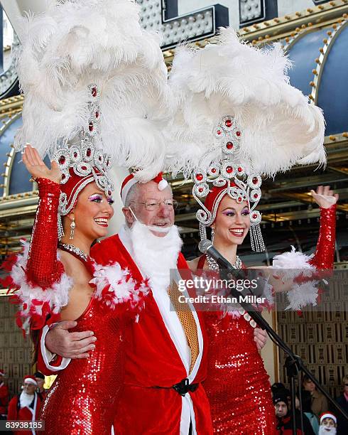 Showgirl Heather Remillard, Las Vegas Mayor Oscar Goodman and showgirl Brooke Opheim appear before the start of Opportunity Village's fourth annual...