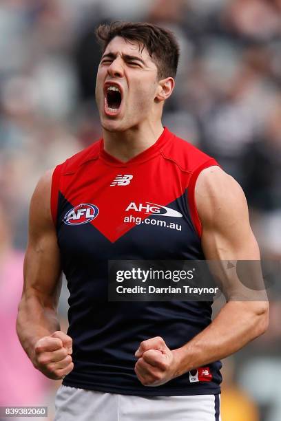 Christian Petracca of the Demons celebrates a goal during the round 23 AFL match between the Collingwood Magpies and the Melbourne Demons at...