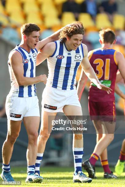 Ben Brown of the Kangaroos celebrates a goal during the round 23 AFL match between the Brisbane Lions and the North Melbourne Kangaroos at The Gabba...