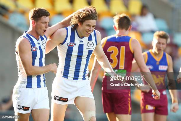 Ben Brown of the Kangaroos celebrates a goal during the round 23 AFL match between the Brisbane Lions and the North Melbourne Kangaroos at The Gabba...