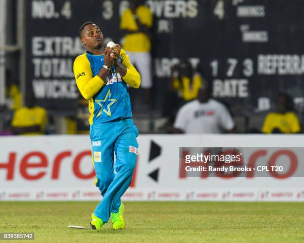 In this handout image provided by CPL T20, of Jamaica Tallawahs Marlon Samuels of St Lucia Stars takes the catch to dismiss during Match 23 of the...