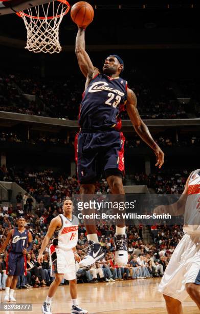 LeBron James of the Cleveland Cavaliers slam dunks against the Charlotte Bobcats on December 06, 2008 at the Time Warner Cable Arena in Charlotte,...