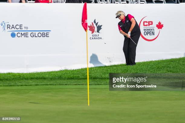 Laura Davies plays a shot from the rough onto the green of the 18th hole during the second round of the Canadian Pacific Women's Open on August 25,...