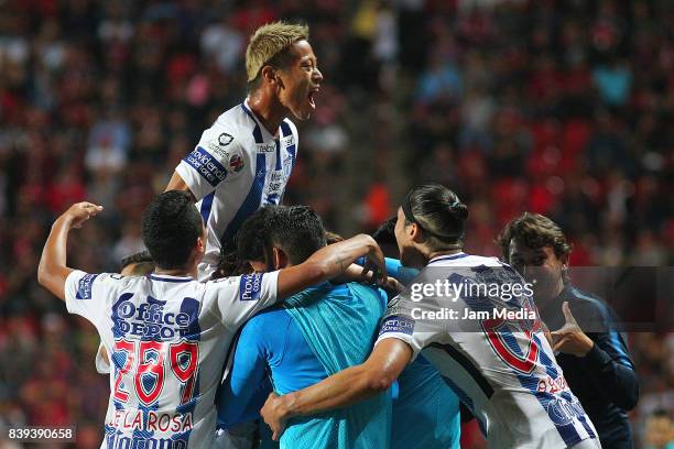 Jose Martinez of Pachuca celebrates with teammates after scoring the first goal of his team during the seventh round match between Tijuana and...