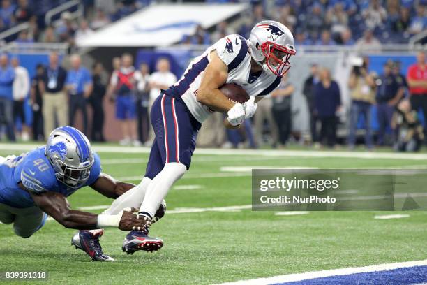 New England Patriots wide receiver Chris Hogan runs the ball for a touch down during the first half of an NFL football game against the Detroit Lions...