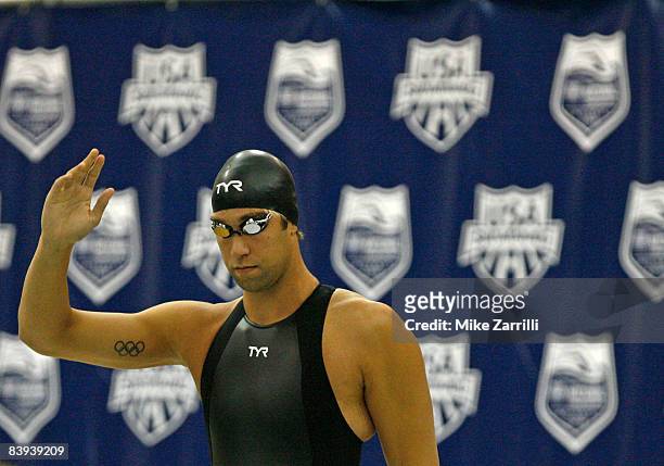 Matt Grevers waves to the crowd before swimming in the finals of the 100 yard freestyle during the 2008 Short Course National Championships at the...